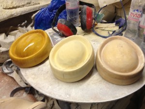 stages of finish of a wood hat block