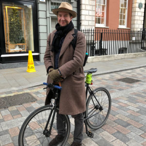 Man with hat and bike at Covent Garden